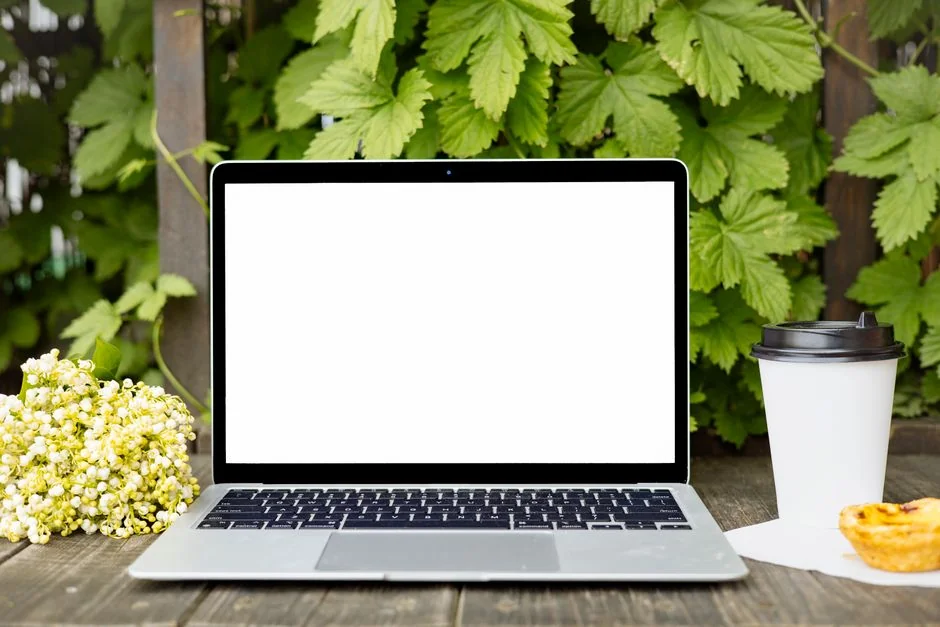 A close-up view of a laptop displaying a search engine page.